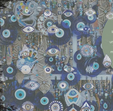 a wall hanging with evil eye eyeballs and evil eyeballs