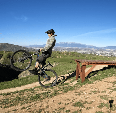 mountain biker going off drop