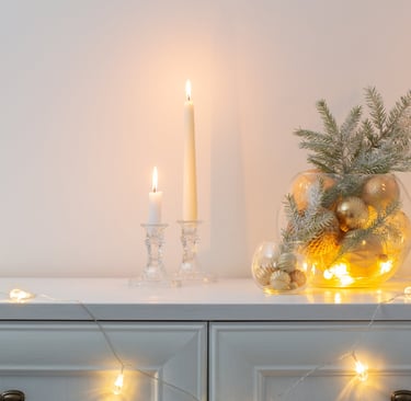 a dresser with candles and candles on it