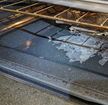 Burnt aluminum folio inside a stove