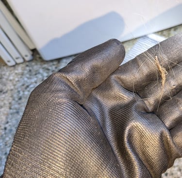 Hairs on a hand that wears black glove