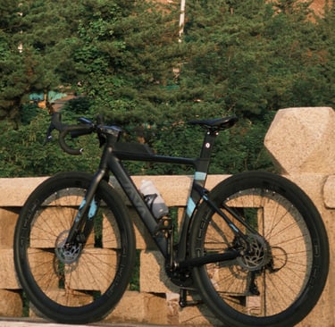 a bicycle parked on a stone wall
