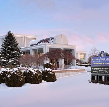 office building with snow covered trees