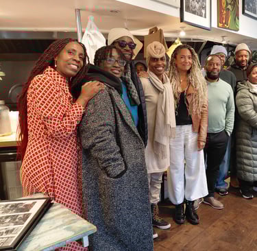 a group of people standing in the Portobello Shack