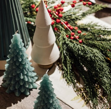 a table with christmas decorations and candles