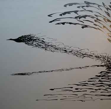 a bird flying over a body of water