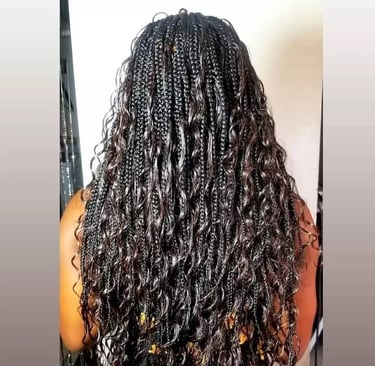 a woman with curly goddess braids