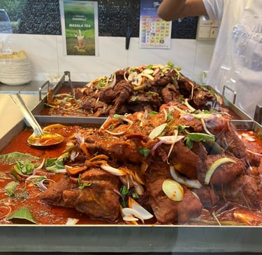 Stacks of curried chicken at Nasi Kandar in Malaysia 