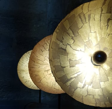 a group of lamps with a light on top of a table