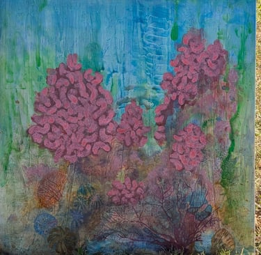 A color dense painting of a coral reef with a clouded blue sky above rendered in gloss acrylics on linen by Kathy LaFollett.