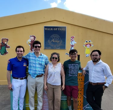 A group of people taking a picture side by side