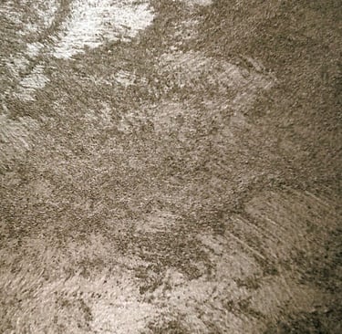 A warm silver paint sample showing its lustre and beautiful grainy texture.