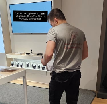 a man standing in front of a large screen