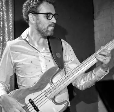 Black and white photo of Hank playing bass.