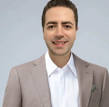 a man in a suit and tie is smiling