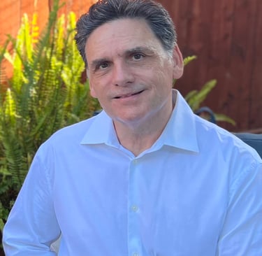 a man in a white shirt and a planter