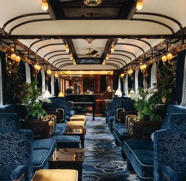 Art deco bar car inside the Venice Simplon-Orient-Express with plush blue velvet seating.