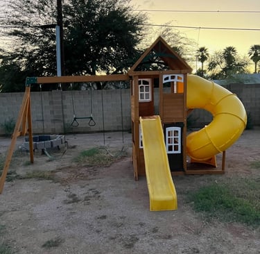 a playground with a slider and a slider