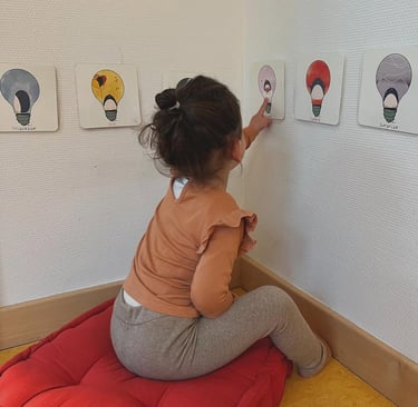 a young girl is playing with a toy