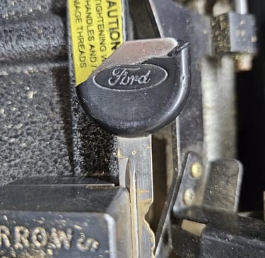 A close up a of ford key that is damaged and fixed by trusted Jacks’s Locksmith key cutting service in Candler, NC
