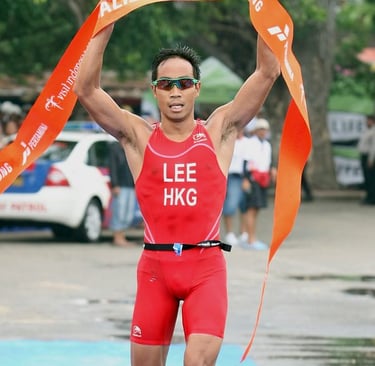 Photo of Daniel Lee, Hong Kong triathlete, crossing the finish line at the Bali 2008 triathlon