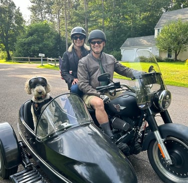 picture of Dr. Goslin, wife, and dog in a sidecar