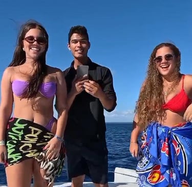 a group of people standing on a boat
