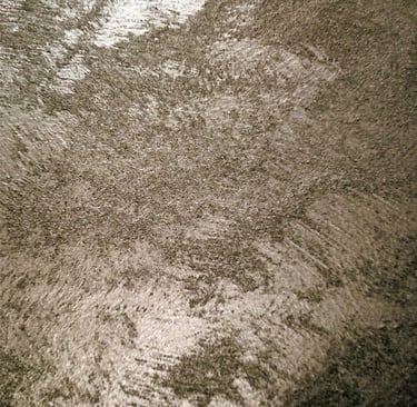 A warm silver paint sample showing its lustre and beautiful grainy texture.