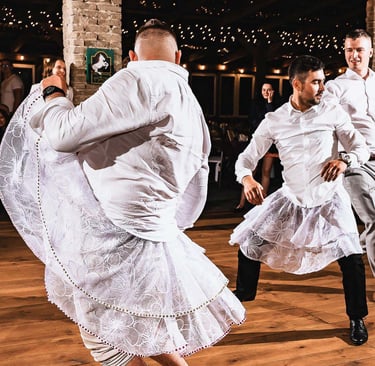 a couple of men and women dancing in a dance floor