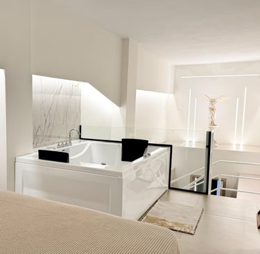 Double seated Jacuzzi with hydro massage feature overlooking the statue of Nike