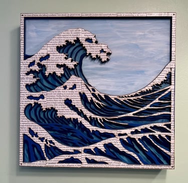 laser cut and painted three dimensional wooden ocean wave cresting with whitecaps made of book pages
