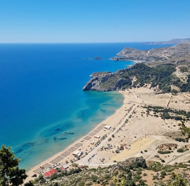 a beach with a sandy beach and a blue sky