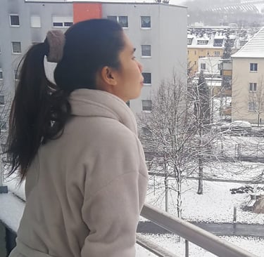 a woman in a coat and a coat over her head