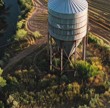 a large water tank sitting on top of a field