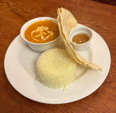 Rice and Poppodum serverd with and Indian curry