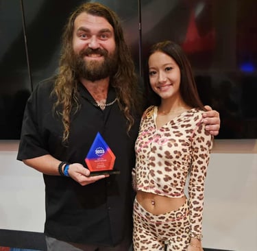 Award recipient recognized at a Fear Fame Arts Foundation supported event.