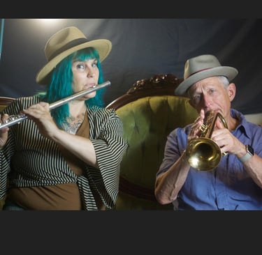 Two band members play music together