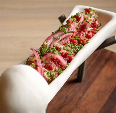 a long rectangular dish with a long, thin, thin, and thinly sliced