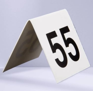 White Acrylic Table Tent with a number 55