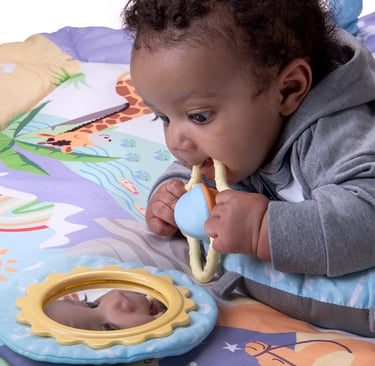 Baby playing on an Arabic playmat by Desi Doll