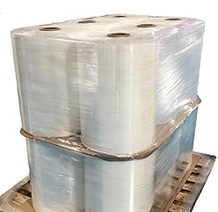 Strapping machine applying PET straps to export pallets