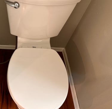 Sanitized toilet with clean surroundings – SparkEaseCleaning detailed restroom cleaning services.