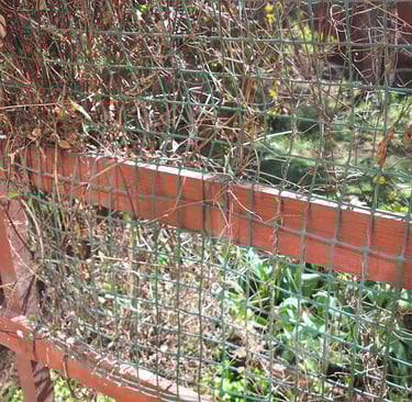 a fence that holds compost