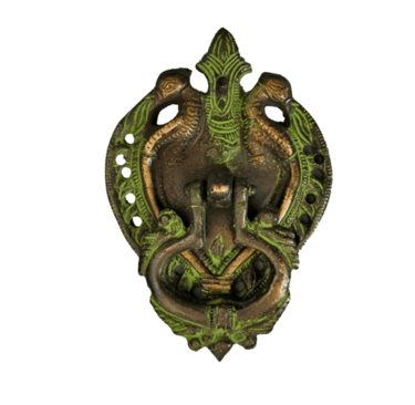 a metal wall mounted with a green dragonfly