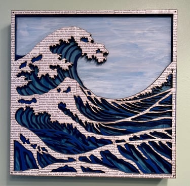 laser cut and painted three dimensional wooden ocean wave cresting with whitecaps made of book pages