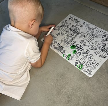 Toddler using a Scribbly Kids reusable drawing mat at home for creativity and screen-free play