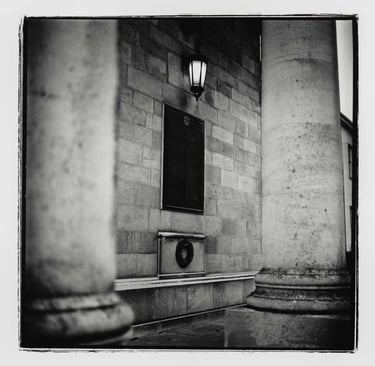 A plaque on the wall in Cambridge University building, 2024.