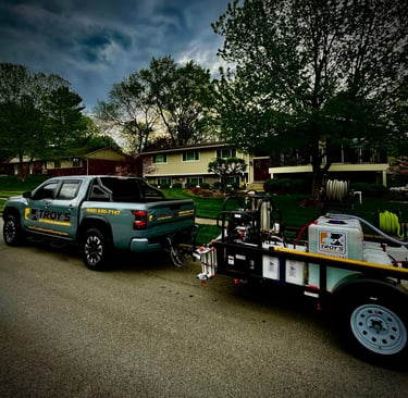 a truck with a trailer attached to it with pressure washer and water tank