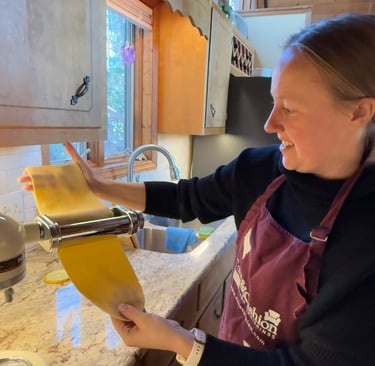 Class participant making an authentic pasta noodle
