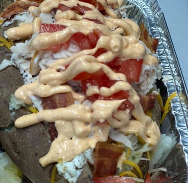 Out of this world Silly Potato! Loaded with chicken , eggs, spinach, onion, tomato, and cheese